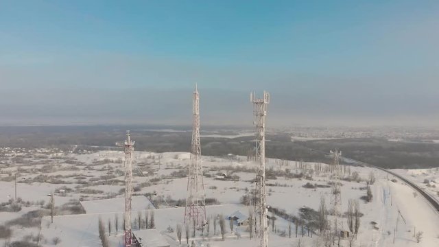 Aerial view frozen television towers in winter.