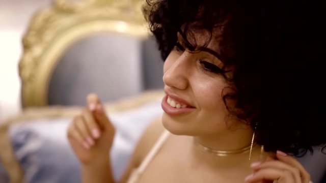 Portrait of a beautiful happy smling young woman in sexy lingerie, joyful girl.