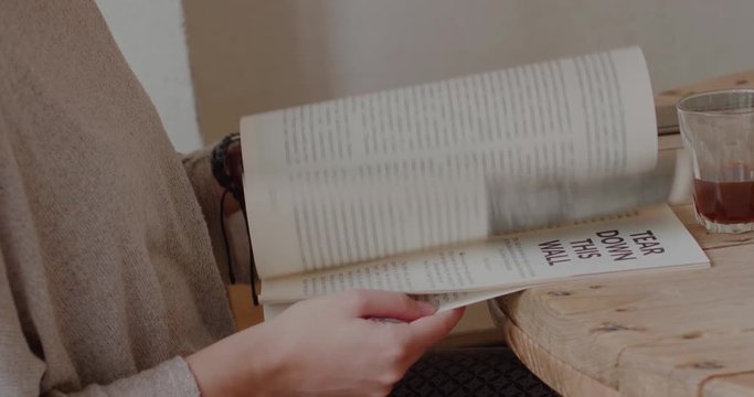 A young female reading newspaper