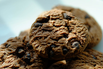 Close up Chocolate cookies in white dish and Light from the window