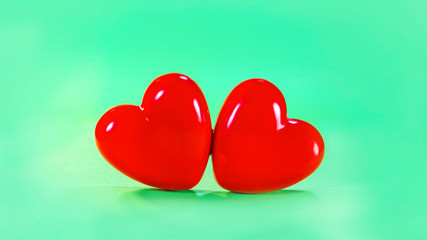 two heart symbol on green background.