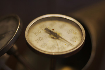 old measurement gauge on dark background