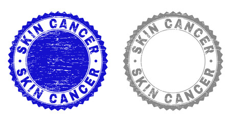 Grunge SKIN CANCER stamp seals isolated on a white background. Rosette seals with grunge texture in blue and gray colors. Vector rubber stamp imitation of SKIN CANCER tag inside round rosette.