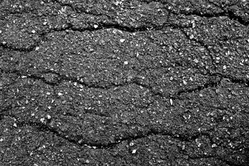 crack and texture of asphalt road - top view background.