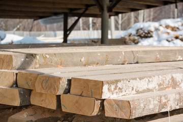 Fototapeta na wymiar Logs sawn on the boards. Sawing boards. A lot of lumber.