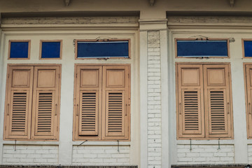 Old vintage wooden brown house windows background.