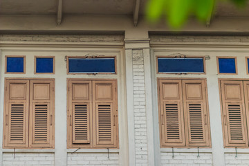 Old vintage wooden brown house windows background.