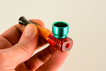 Smoking colored pipe