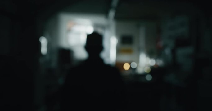 Slow motion of experienced glass blower entering in his workshop for starting a work. Shot in 8K. Concept of handmade, high quality, artisan, made in Italy,glass blowing