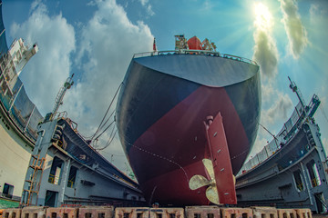 commercial ocean tannage ship in floating dry dock yard, recondition, repairing, painting overhaul...