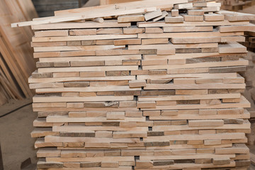 Wooden boards in a stack. Pine boards. A lot of lumber.