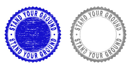 Obraz premium Grunge STAND YOUR GROUND stamp seals isolated on a white background. Rosette seals with grunge texture in blue and grey colors.