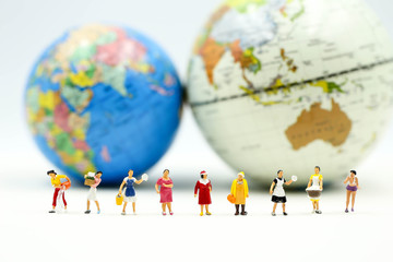 Miniature people : Group of Women Teamwork Happiness with world map using for concept of International women day.