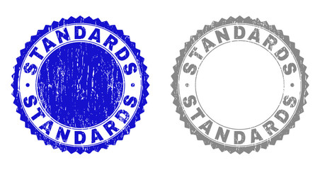 Grunge STANDARDS stamp seals isolated on a white background. Rosette seals with grunge texture in blue and grey colors. Vector rubber stamp imprint of STANDARDS text inside round rosette.