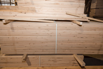 Wooden boards in a stack. Pine boards. A lot of lumber.