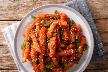 Crispy Honey Chilli Potatoes Delicious spicy snack on a plate close-up. horizontal top view