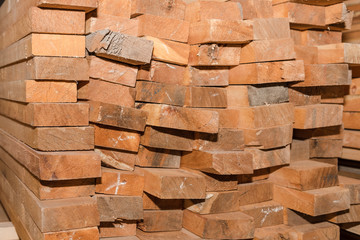 Wooden boards in a stack. Pine boards. A lot of lumber.