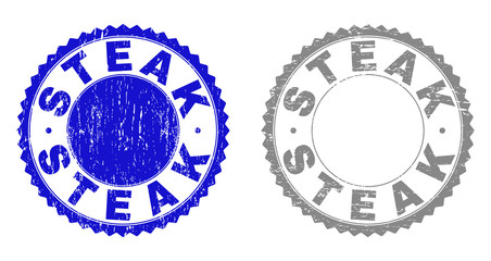 Grunge STEAK stamp seals isolated on a white background. Rosette seals with grunge texture in blue and gray colors. Vector rubber stamp imprint of STEAK caption inside round rosette.