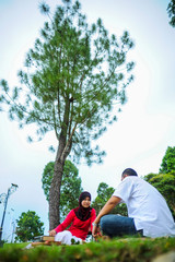 A young couple spend their time together at park to enjoy the day