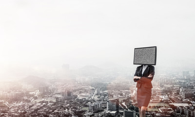 Business woman with TV instead of head.