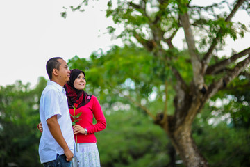 Fototapeta premium Young couple in love at the park enjoy the together. A happiness couple together. 