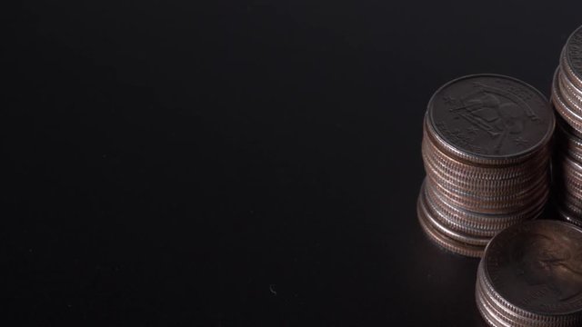 Close up of a stack of Quarters moving from left to right.