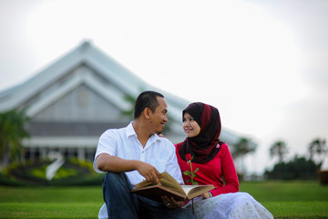 A young couple spend their time together at park to enjoy the day