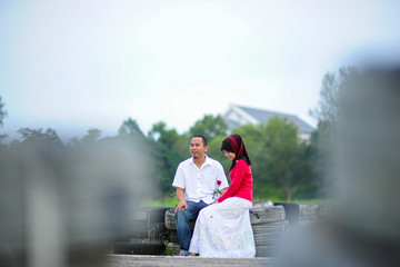 Young couple at park enjoy the day