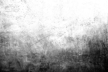 Black and white scratched grunge plaster wall texture for background with copy space on top.
