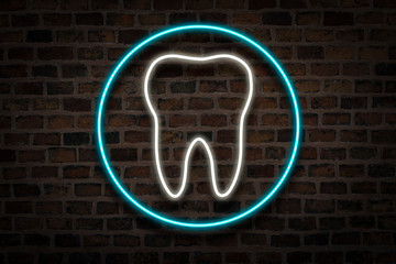 Tooth, neon sign on a brick wall background. Dental clinic concept, first aid