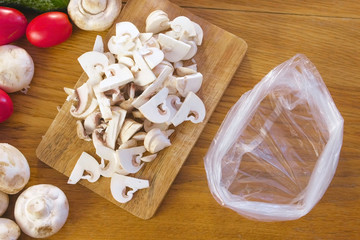 Plastic bag for freezing mushrooms in a bag on kitchen table.