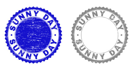 Grunge SUNNY DAY watermarks isolated on a white background. Rosette seals with grunge texture in blue and gray colors. Vector rubber watermark of SUNNY DAY caption inside round rosette.