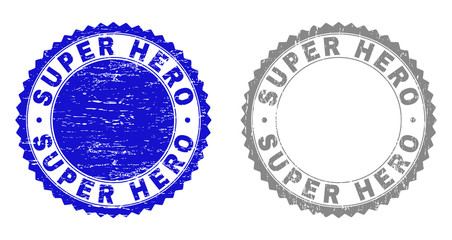 Grunge SUPER HERO stamp seals isolated on a white background. Rosette seals with grunge texture in blue and grey colors. Vector rubber stamp imitation of SUPER HERO text inside round rosette.