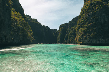 Naklejka na ściany i meble view of iconic tropical turquoise water Pileh Lagoon surrounded by limestone cliffs, Phi Phi islands, Thailand 