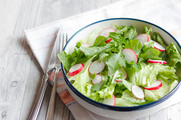 Dietary food for fitness. Radish, Lettuce and Arugula Salad