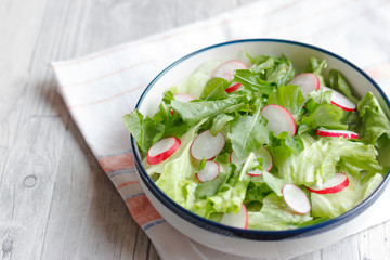 Dietary food for fitness. Radish, Lettuce and Arugula Salad