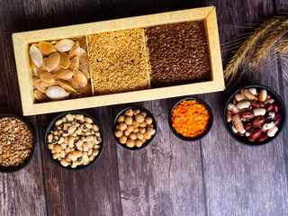 bean seeds, lentil, peas on wooden table, healthy rich with fiber food, food rich in vitamin A, E, B, K, Mg calcium, phosphorus, iron