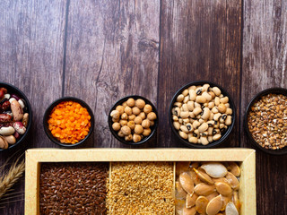 bean seeds, lentil, peas on wooden table, healthy rich with fiber food, food rich in vitamin A, E, B, K, Mg calcium, phosphorus, iron