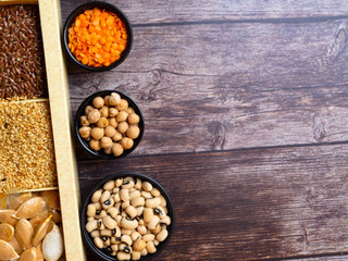 bean seeds, lentil, peas on wooden table, healthy rich with fiber food, food rich in vitamin A, E, B, K, Mg calcium, phosphorus, iron