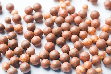 Blush balls on a light background close-up. Selective focus.