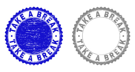 Obraz premium Grunge TAKE A BREAK stamp seals isolated on a white background. Rosette seals with grunge texture in blue and grey colors. Vector rubber stamp imitation of TAKE A BREAK tag inside round rosette.