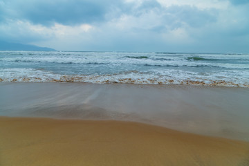 Fototapeta na wymiar Soft wave of Beach near Da Nang in Central Vietnam