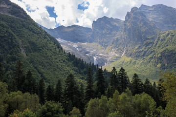 Fototapeta na wymiar Closeup view mountains scenes and far away waterfall in national park of Russia