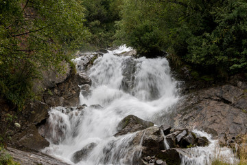 Obraz na płótnie Canvas Closeup view waterfall scenes in mountains, national park Caucasus, Russia