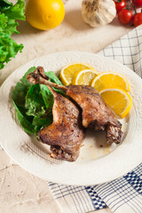 Duck legs confit with orange and salad