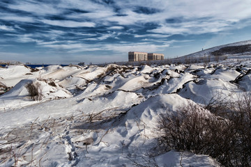 Grunge cityscape. Urban. Dark blue sky. City outskirts. Winter landscape. Ust-Kamenogorsk (Kazakhstan)