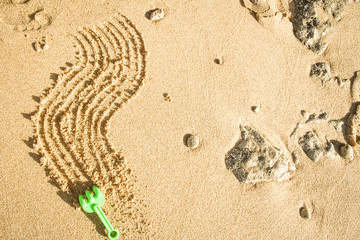 Beautiful drawing on the sand of the sea background