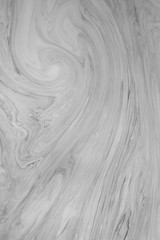 Fototapeta na wymiar Abstract monochrome marble background. Stains of paint on the surface of the water.