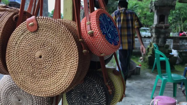 Rattan eco bags in the art shop on Bali island, Indonesia. Woman stylish eco bag.