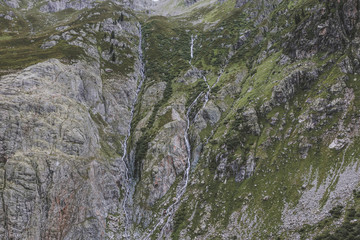 Closeup mountains scenes, walk to Trift Bridge in national park Switzerland